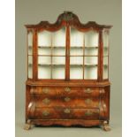 A 19th century Dutch walnut glazed cabinet, fitted with three base drawers.