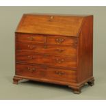 A George III mahogany bureau, with slope front and fitted interior,