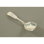 A George III Newcastle silver caddy spoon, maker probably Thomas Watson.