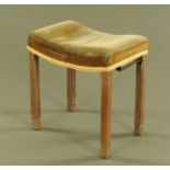 A George VI limed oak Coronation stool, with saddle seat. Height 48 cm, width 46 cm, depth 32 cm.