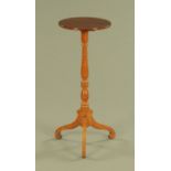 A mahogany candle stand, with circular top,