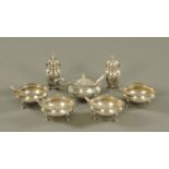 A late Victorian silver cruet set, cased, comprising 4 open salts, mustard and two pepperettes,