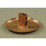 A Newlyn school copper matchbox holder. Diameter 16 cm.