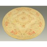 A large Aubusson style rug, circular. Diameter 372 cm (see illustration).