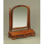 A large Victorian mahogany toilet mirror, with turned columns, hinged compartment,
