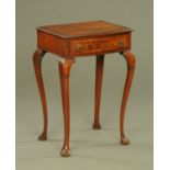 A mahogany bow fronted side table, quarter veneered and crossbanded,