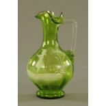 A Victorian Mary Gregory style green glass jug. Height 17.5 cm.