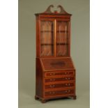 A late 19th/early 20th century bureau bookcase by Shoolbred & Co,