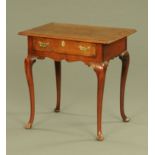 An 18th century oak and mahogany crossbanded lowboy,