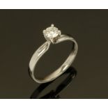 An 18 ct white gold solitaire diamond ring, four claw, size O.