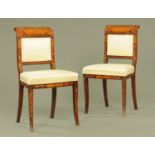 A pair of 19th century Dutch marquetry side chairs, with upholstered seats and raised on sabre legs.