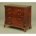 A George III mahogany chest of drawers,