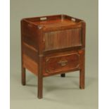 An early 19th century mahogany commode cabinet,