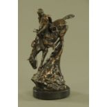 After Frederick Remington, a bronze figure of a Native American on horseback.