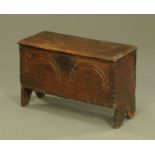 A small 18th century oak six plank coffer, the top with moulded edge,