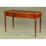 An Edwardian mahogany serpentine fronted serving table,
