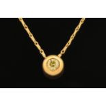 An 18 ct yellow gold slider pendant on chain, set with a diamond weighing +/- .28 carats.