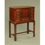 A George III style mahogany fall front secretaire on stand,