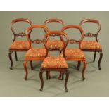 A set of six Victorian mahogany balloon backed dining chairs,