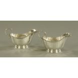 A pair of silver sauce boats, both inscribed to J.A.