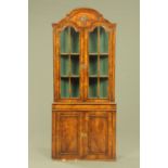 A walnut standing corner cupboard, circa 1930, in the Queen Anne style,