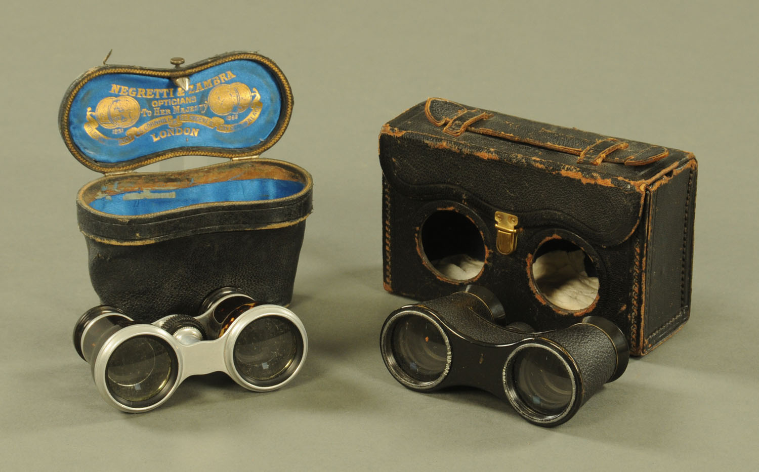 A pair of vintage tortoiseshell opera glasses and another pair.