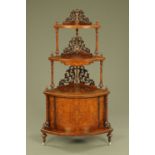 A Victorian walnut three tier graduated whatnot stand and combined cupboard,