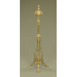 A late 19th/early 20th century brass and copper lamp standard, converted to electricity.