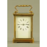 A brass cased carriage clock, timepiece only. Height excluding carrying handle 11 cm.