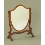 An Edwardian mahogany framed shield shaped toilet mirror, boxwood strung. Width 45 cm.
