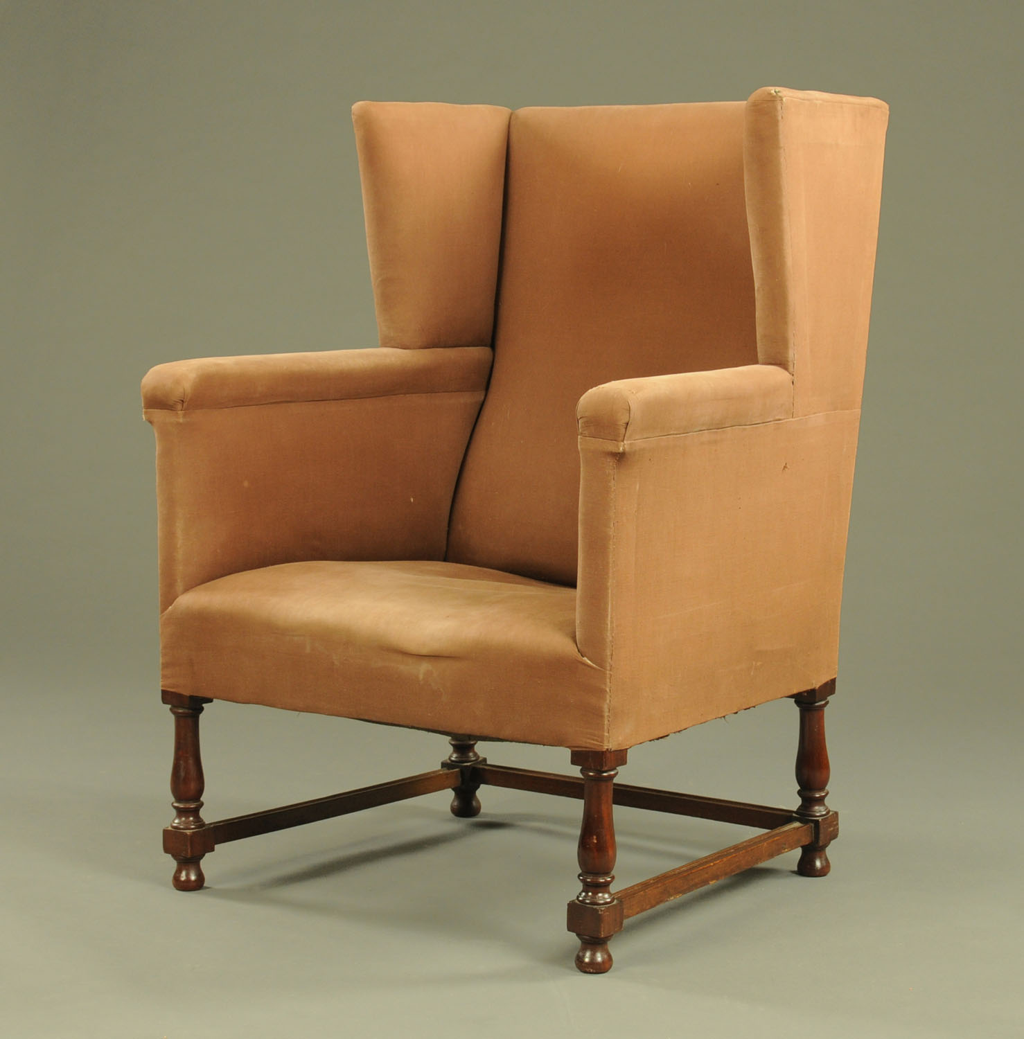 An early 20th century Georgian style mahogany wing easy chair.