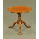 A George III mahogany tripod table, with moulded lip and reduced height centre column,