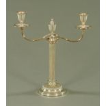 An old Sheffield plate two branch candelabra, with armorial to centre urn.