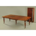 A Regency mahogany extending dining table, with pullout action and three full leaves,