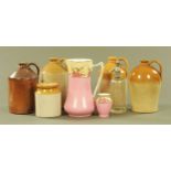 A collection of four stoneware flagons, storage jar, soda syphon, jug and vase.