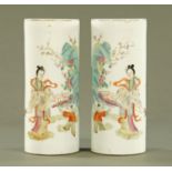 A pair of Chinese cylindrical vases, decorated with figures and fence with square seal mark to base.