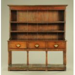 An antique oak dresser with Delft rack,