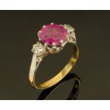 An 18 ct gold ruby and diamond ring, size M,
