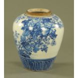 A 19th century Japanese blue and white vase, decorated with chrysanthemum. Height 23 cm.