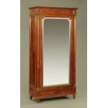 A Continental oak and mahogany wardrobe,