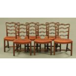 A set of six George III style mahogany ladder back dining chairs, with leather upholstered seats.