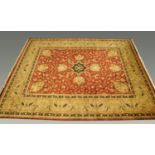 A fine Indo-Persian fringed carpet, with centre rectangular panel and with multiple line border,