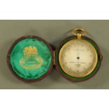 An antique gilt metal pocket barometer by Negretti & Zambra, in leather case.