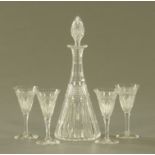 A cut glass liquor set, comprising small decanter and four glasses. Decanter height 24 cm.
