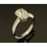 An 18 ct white gold oval diamond ring, diamond +/- 2.51 carats, certificated HS13, size M.