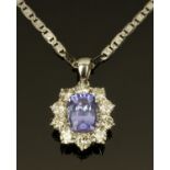 An 18 ct gold tanzanite and diamond necklace, tanzanite +/- 5 carats, diamonds +/- 2 carats.