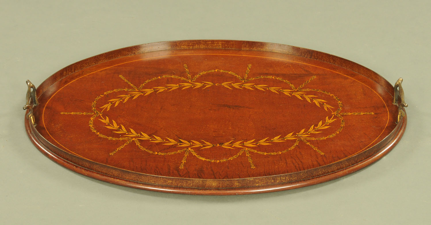 An Edwardian inlaid mahogany oval tray. Length 66 cm.