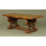 A late Victorian mahogany refectory style table, with rectangular top, carved and moulded ends,