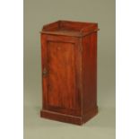 A late Victorian mahogany bedside cabinet, with three quarter gallery,