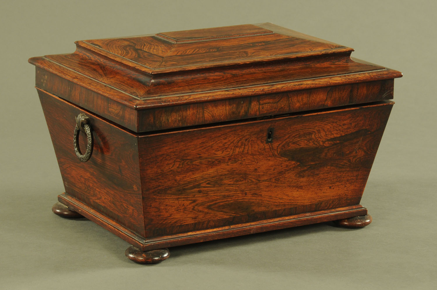 A Regency rosewood table box, with bronze handles, sarcophagus form with interior fitted for sewing.